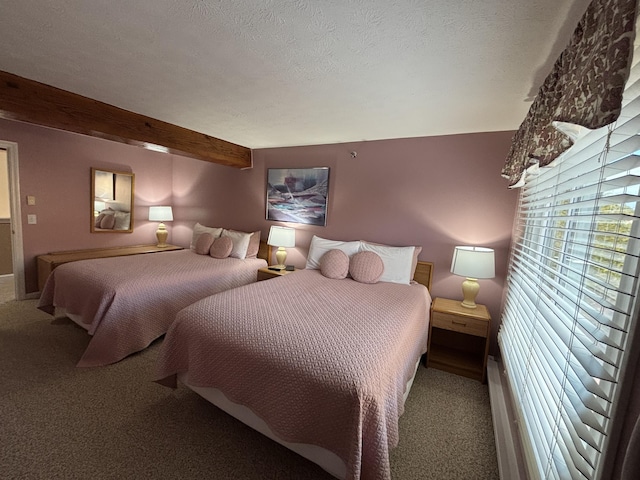 1351 Post Rd Unit 49, Wells, ME 04090 - bedroom with carpet, a textured ceiling, and beam ceiling