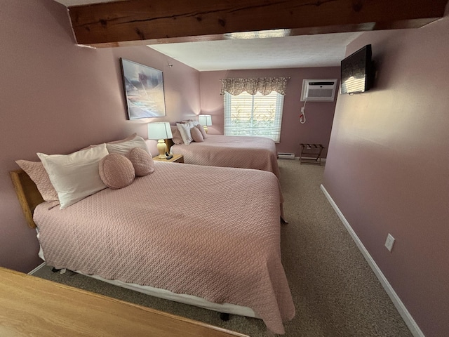 1351 Post Rd Unit 49, Wells, ME 04090 - carpeted bedroom featuring a wall mounted air conditioner, baseboards, and beamed ceiling