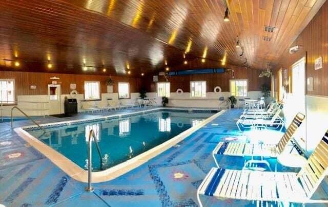 1351 Post Rd Unit 49, Wells, ME 04090 - indoor community pool featuring a patio