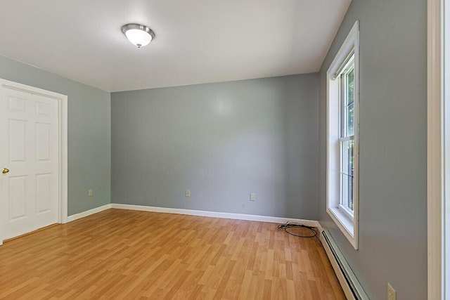 40 Guptill Rd, Belgrade, ME 04917 - spare room with healthy amount of natural light, light wood-style flooring, and a baseboard radiator