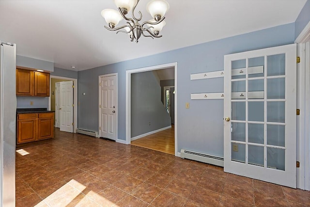 40 Guptill Rd, Belgrade, ME 04917 - unfurnished dining area with baseboard heating and a chandelier
