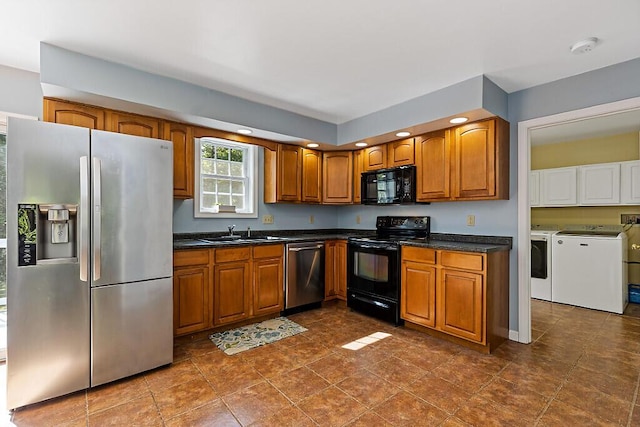 40 Guptill Rd, Belgrade, ME 04917 - kitchen with black appliances, washing machine and clothes dryer, brown cabinets, dark countertops, and recessed lighting