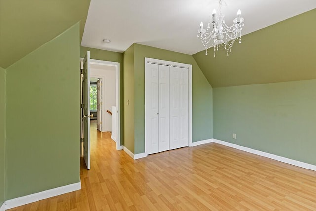40 Guptill Rd, Belgrade, ME 04917 - bonus room with a chandelier, lofted ceiling, and light wood-type flooring