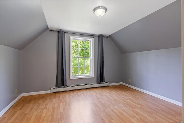 40 Guptill Rd, Belgrade, ME 04917 - additional living space featuring baseboard heating, light wood-type flooring, and vaulted ceiling