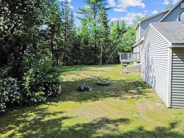 40 Guptill Rd, Belgrade, ME 04917 - view of grassy yard with a deck