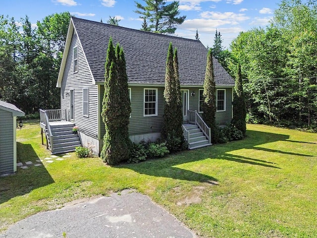 40 Guptill Rd, Belgrade, ME 04917 - cape cod-style house featuring a shingled roof and a front yard