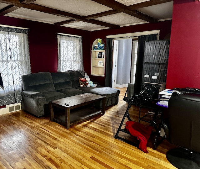 33 Washington St, Caribou, ME 04736 - living area with coffered ceiling, hardwood / wood-style floors, and beamed ceiling