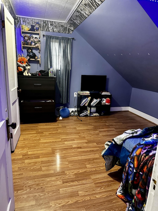 33 Washington St, Caribou, ME 04736 - bedroom with wood finished floors, vaulted ceiling, and baseboards