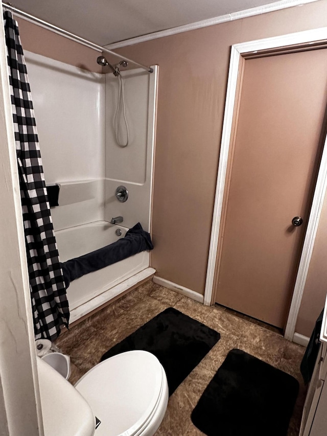 33 Washington St, Caribou, ME 04736 - bathroom featuring shower / bath combo with shower curtain, toilet, and baseboards