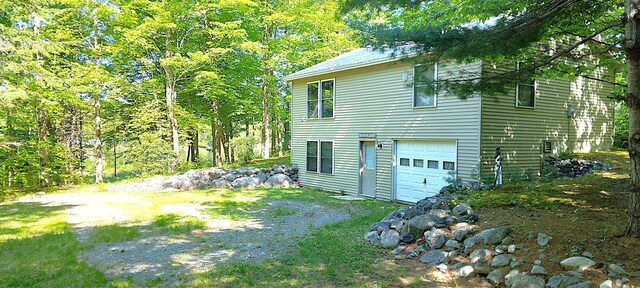 20 Blue Jay Dr, Embden, ME 04958 - view of home's exterior with driveway and a garage