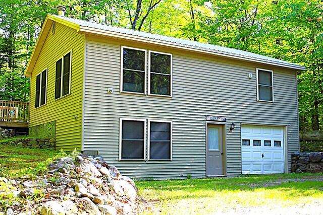 20 Blue Jay Dr, Embden, ME 04958 - view of property exterior with metal roof and a deck