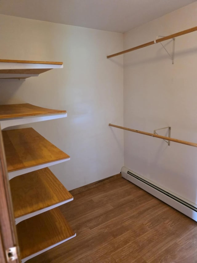 61 Gagnon Rd, Oakland, ME 04963 - walk in closet with a baseboard radiator and wood finished floors