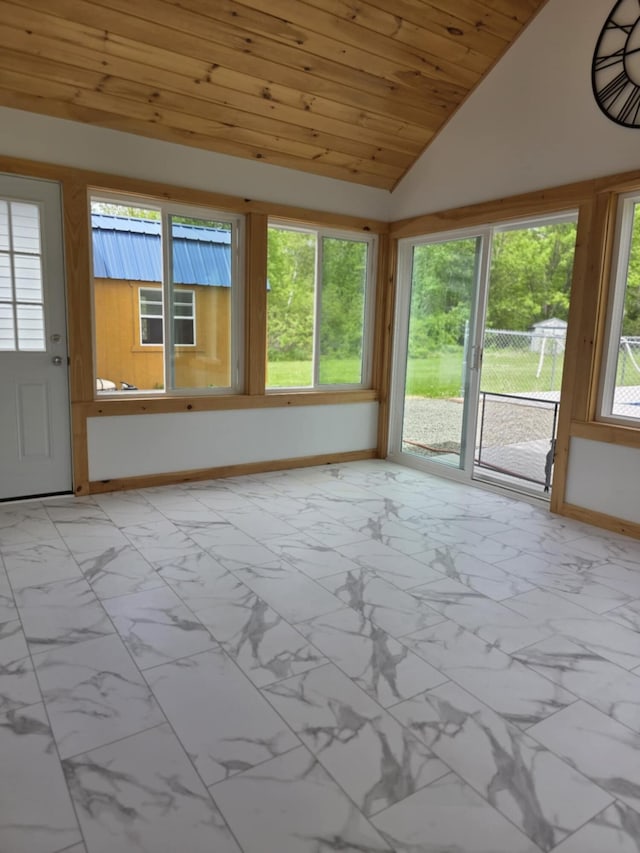 61 Gagnon Rd, Oakland, ME 04963 - unfurnished sunroom with baseboards, marble finish floors, vaulted ceiling, and wooden ceiling