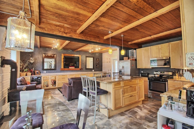 14 Jude Ln, Ellsworth, ME 04605 - kitchen with stainless steel appliances, wood ceiling with exposed beams, light brown cabinetry, open floor plan, and beverage cooler