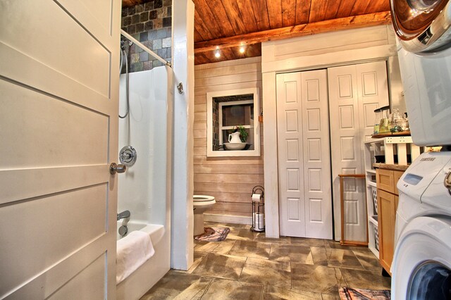 14 Jude Ln, Ellsworth, ME 04605 - washroom featuring wooden ceiling, stacked washer / dryer, and wood walls