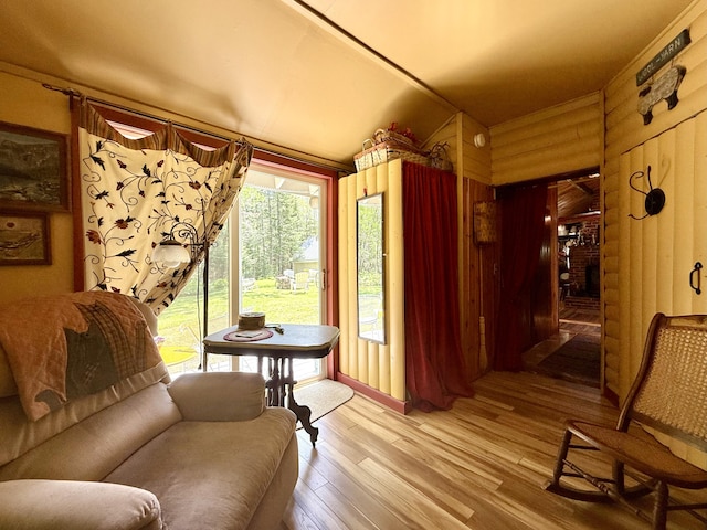 22 Old Mill Rd, Talmadge, ME 04492 - sitting room featuring light wood-style floors and wooden walls