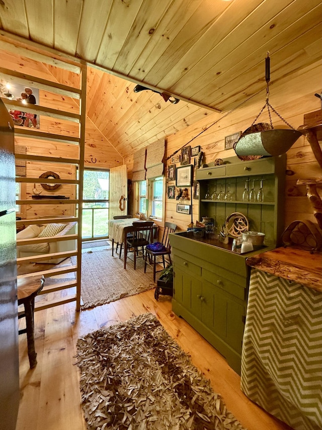 22 Old Mill Rd, Talmadge, ME 04492 - dining area with wood walls, wood ceiling, wood-type flooring, and lofted ceiling