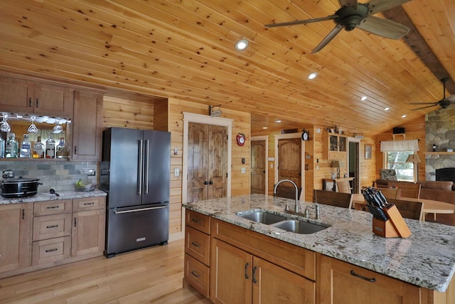 500 Black Point Rd, Beaver Cove, ME 04441 - kitchen with freestanding refrigerator, a ceiling fan, a sink, light wood finished floors, and lofted ceiling