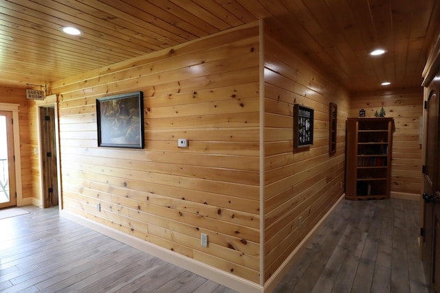 500 Black Point Rd, Beaver Cove, ME 04441 - corridor with wooden walls, recessed lighting, wood-type flooring, wooden ceiling, and baseboards