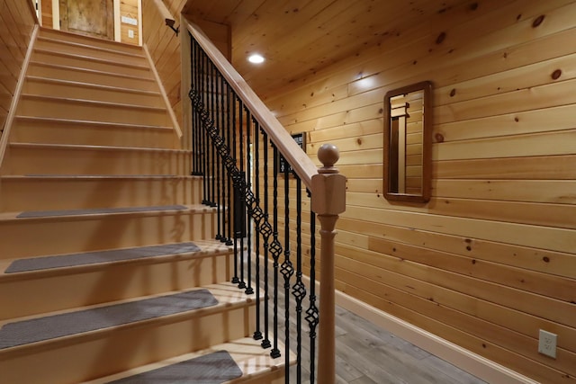500 Black Point Rd, Beaver Cove, ME 04441 - stairway with wood walls, wood finished floors, and recessed lighting