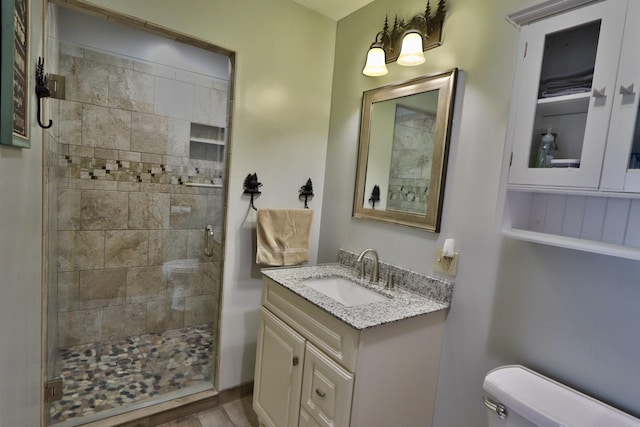 500 Black Point Rd, Beaver Cove, ME 04441 - bathroom with toilet, vanity, and a tile shower