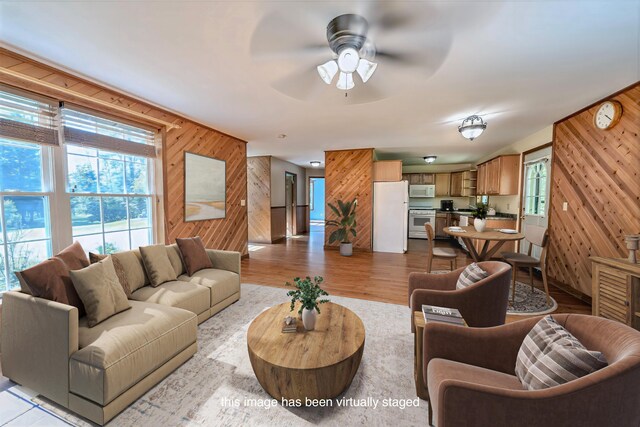 3 Reeds Ln, Belfast, ME 04915 - living room with wooden walls, ceiling fan, and wood finished floors