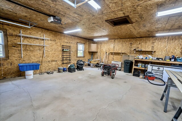3 Reeds Ln, Belfast, ME 04915 - garage featuring a workshop area and a garage door opener