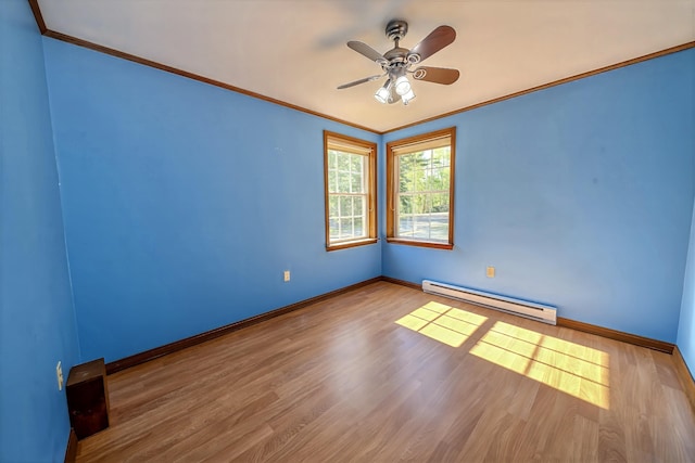 3 Reeds Ln, Belfast, ME 04915 - spare room featuring baseboard heating, baseboards, crown molding, wood finished floors, and ceiling fan