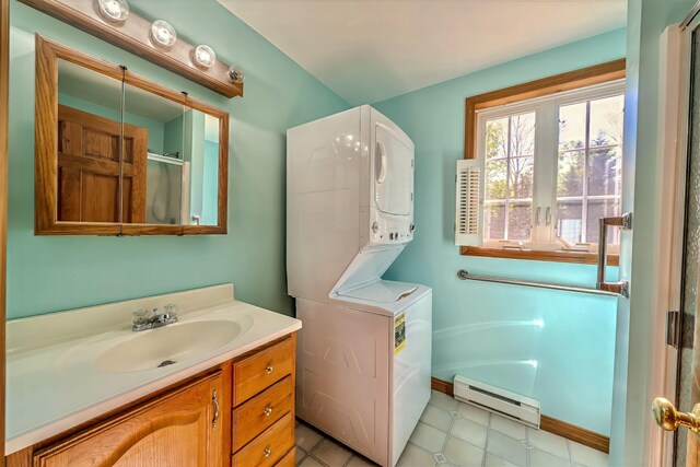 3 Reeds Ln, Belfast, ME 04915 - bathroom with a baseboard radiator, vanity, and a shower with shower door