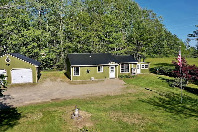 3 Reeds Ln, Belfast, ME 04915 - view of front of property with driveway, an outbuilding, a detached garage, a front yard, and metal roof