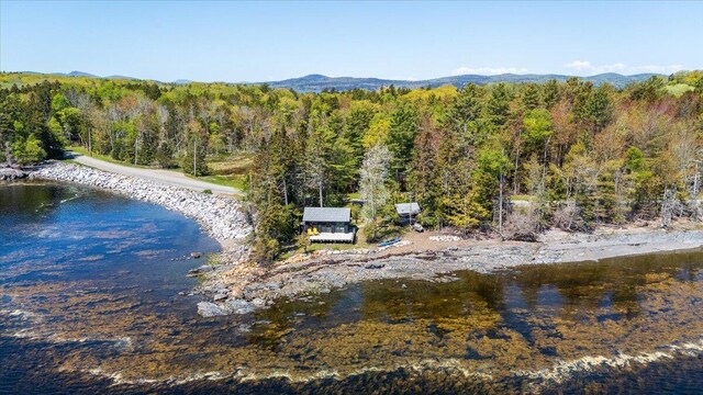 459 Main Rd, Islesboro, ME 04848 - water view featuring a heavily wooded area and a mountainous background