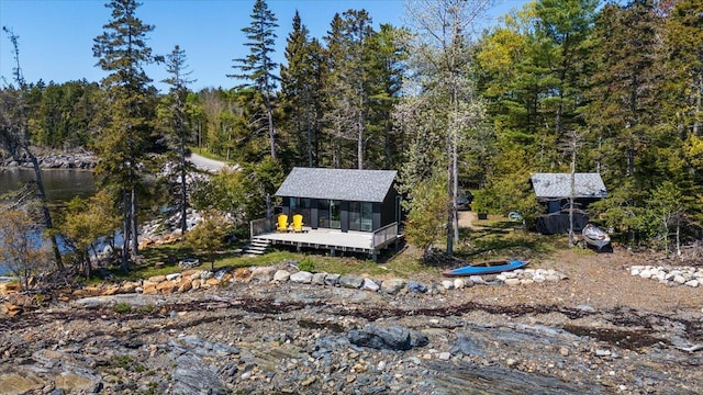 459 Main Rd, Islesboro, ME 04848 - view of front of property with a deck and a forest view