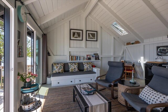 459 Main Rd, Islesboro, ME 04848 - living room with a skylight, wooden ceiling, and wooden walls
