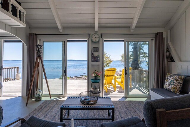 459 Main Rd, Islesboro, ME 04848 - living room with a water view, wood ceiling, and arched walkways