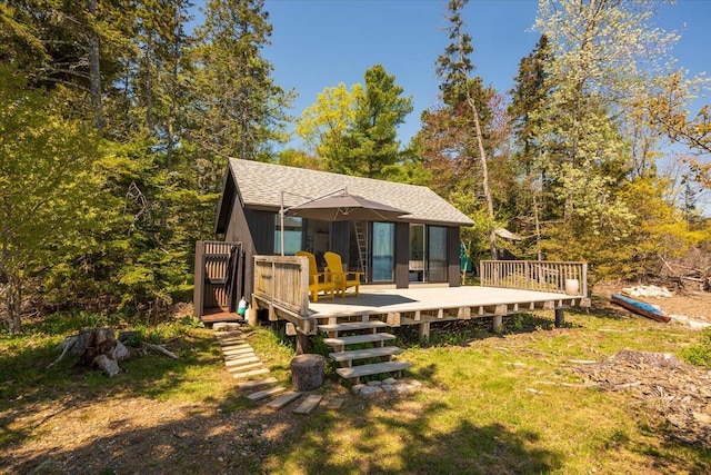 459 Main Rd, Islesboro, ME 04848 - back of property with a deck and roof with shingles