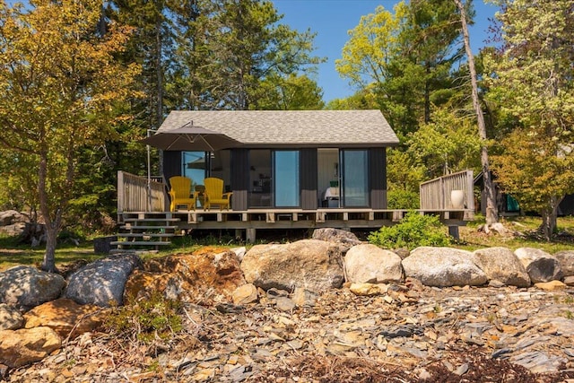 459 Main Rd, Islesboro, ME 04848 - view of front of property featuring a wooden deck and roof with shingles
