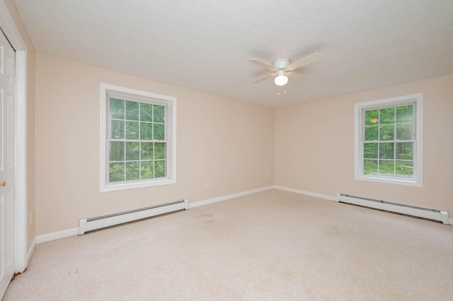 68 Lone Pine Rd, Waterboro, ME 04061 - carpeted spare room with a baseboard heating unit, ceiling fan, and baseboards