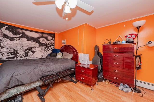 68 Lone Pine Rd, Waterboro, ME 04061 - bedroom with wood finished floors, a baseboard heating unit, and a ceiling fan