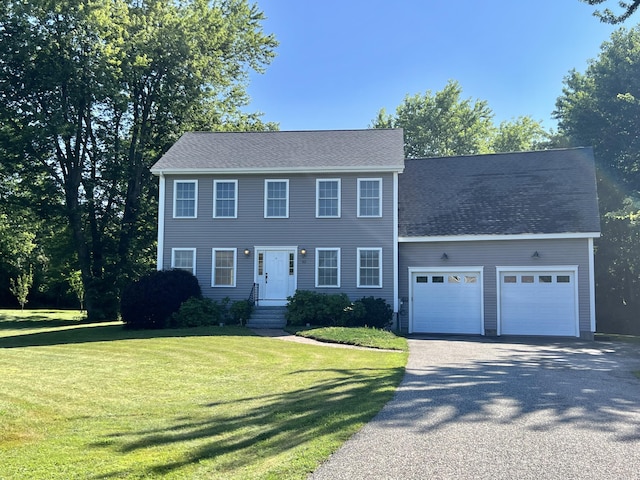 52 Peary Ter, South Portland, ME 04106 - colonial inspired home with asphalt driveway, an attached garage, and a front lawn