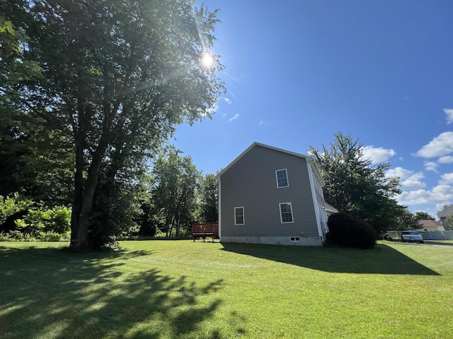 52 Peary Ter, South Portland, ME 04106 - view of side of home with a lawn and a wooden deck