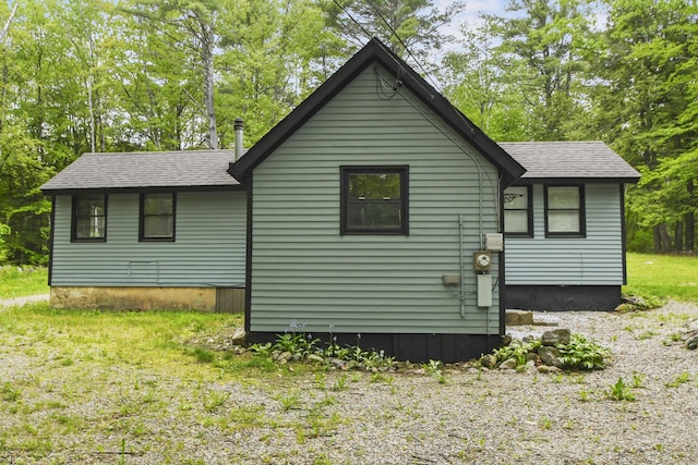 398 Hopper Rd, Acton, ME 04001 - view of home's exterior with roof with shingles and view of scattered trees