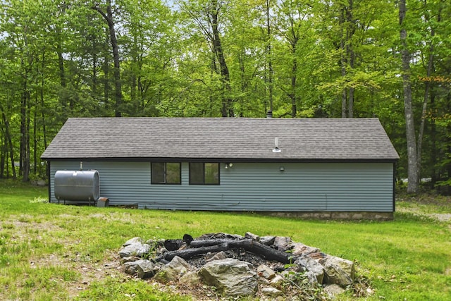 398 Hopper Rd, Acton, ME 04001 - view of side of property featuring oil tank and roof with shingles