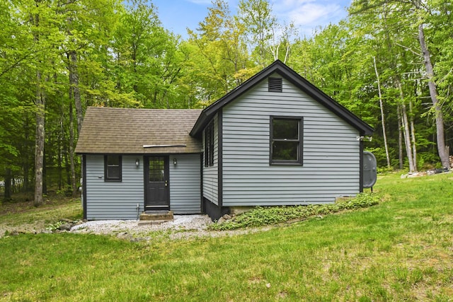 398 Hopper Rd, Acton, ME 04001 - view of front facade with a shingled roof, a front lawn, and entry steps