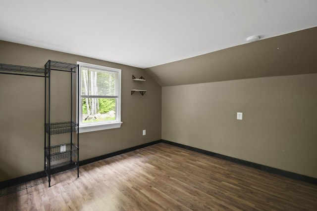 398 Hopper Rd, Acton, ME 04001 - bonus room with wood finished floors, baseboards, and lofted ceiling