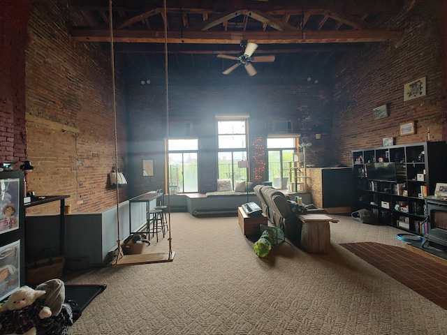 92-94 Main St, Auburn, ME 04210 - living area featuring brick wall, carpet flooring, a high ceiling, and a ceiling fan