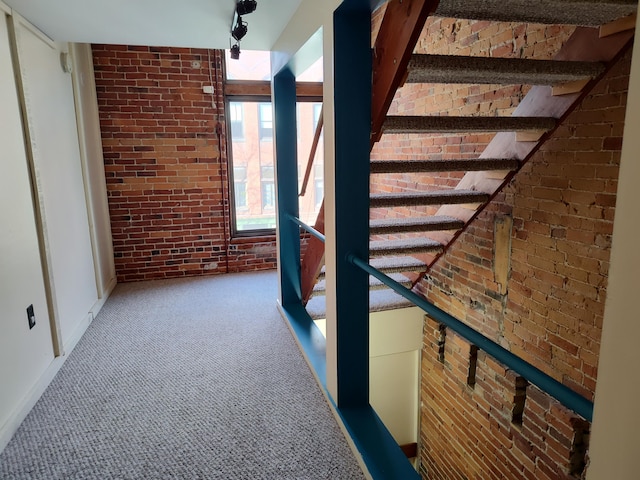 92-94 Main St, Auburn, ME 04210 - hall with brick wall, carpet flooring, and stairs