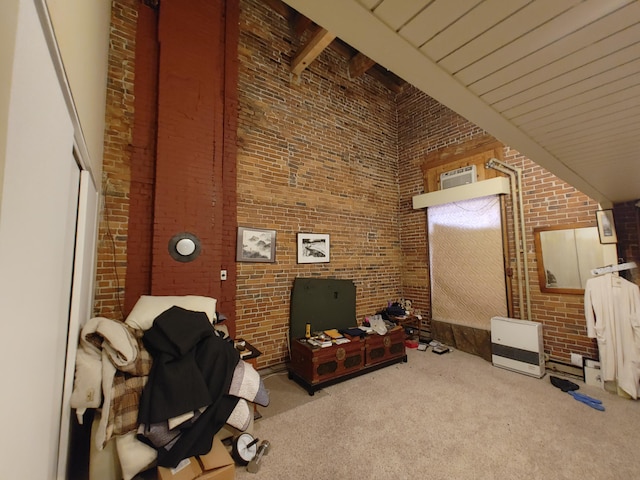 92-94 Main St, Auburn, ME 04210 - carpeted living area featuring brick wall, a high ceiling, and beamed ceiling