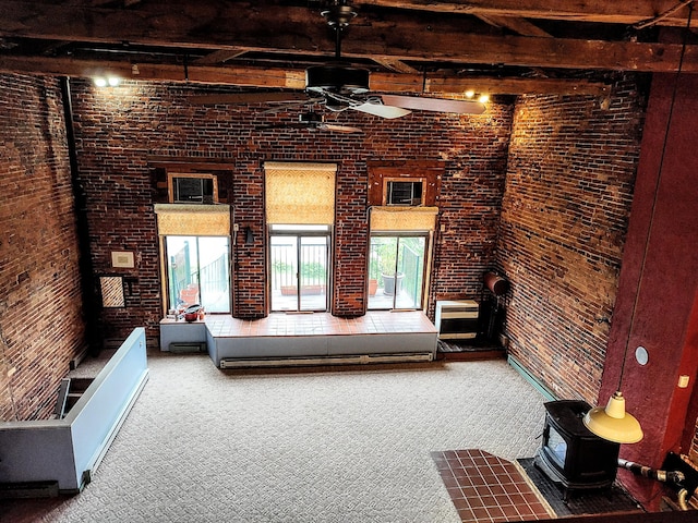 92-94 Main St, Auburn, ME 04210 - living area featuring ceiling fan, brick wall, a wood stove, carpet, and beamed ceiling