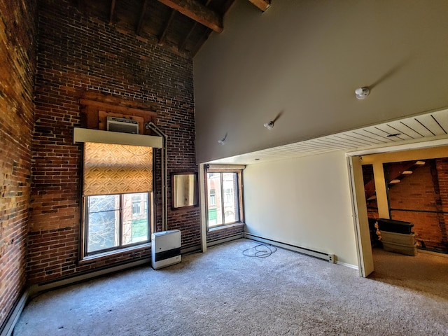 92-94 Main St, Auburn, ME 04210 - unfurnished living room featuring high vaulted ceiling, carpet, brick wall, a baseboard radiator, and baseboards