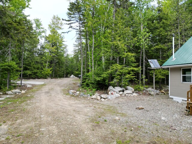 121 Loop Rd, Lincoln, ME 04457 - view of yard featuring a wooded view